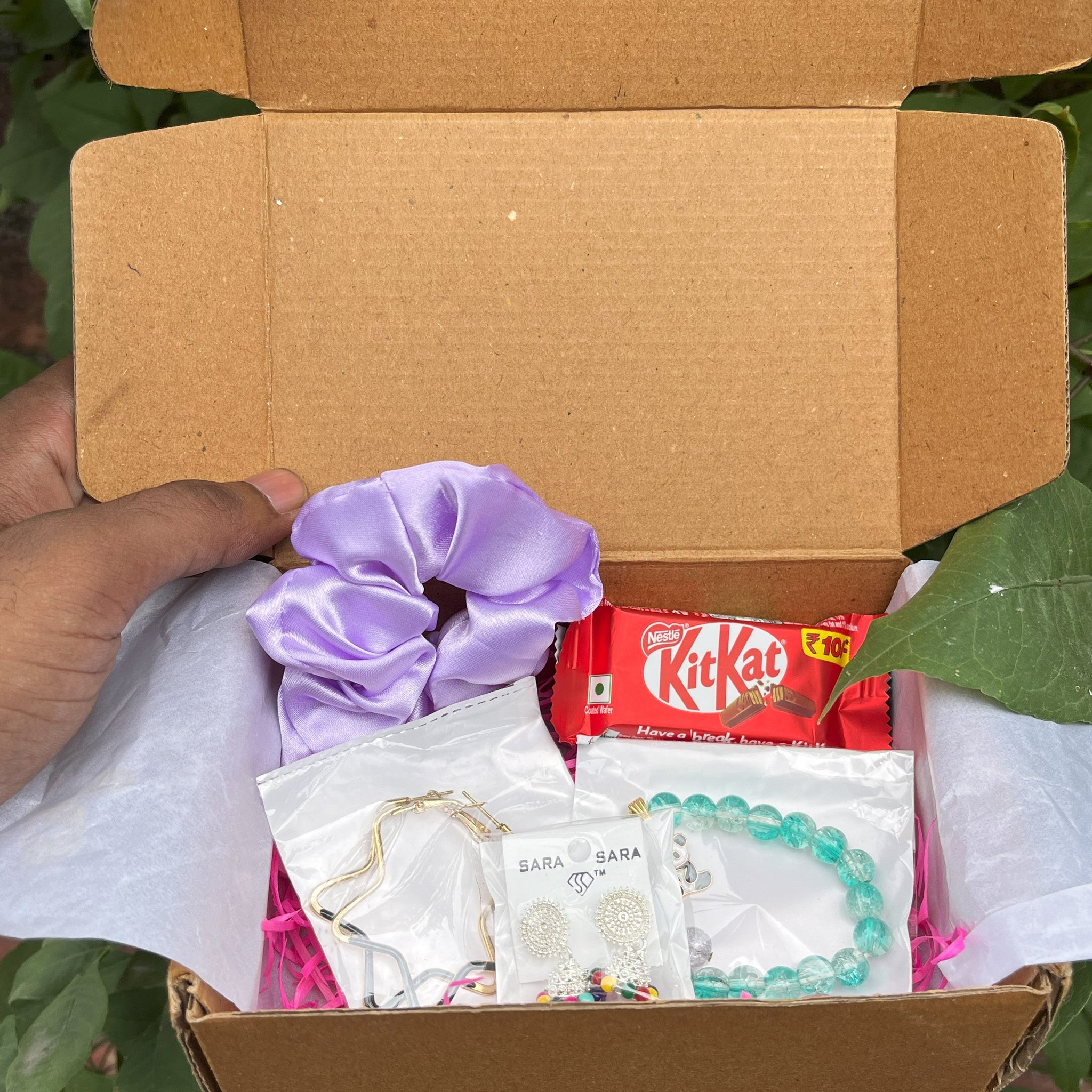 Gift box with accessories and treats with a free  ring