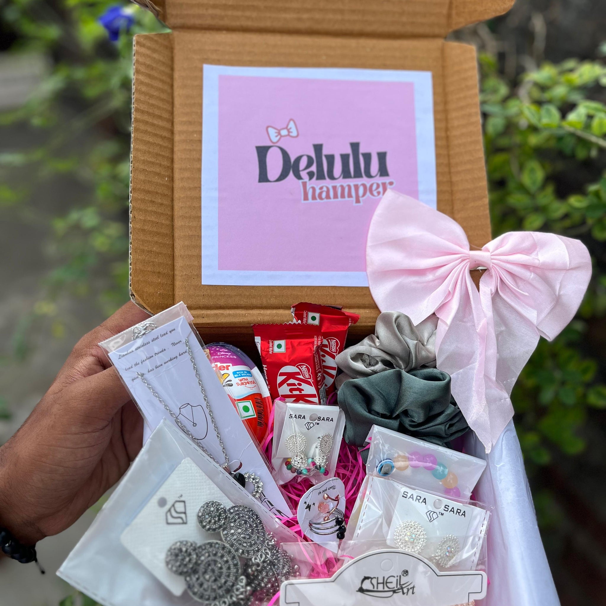 A thoughtfully curated gift box filled with accessories and treats, perfect for a special someone.