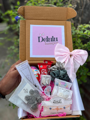 A thoughtfully curated gift box filled with accessories and treats, perfect for a special someone.